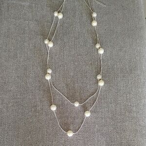 Elegant White Necklace with Intricate Design